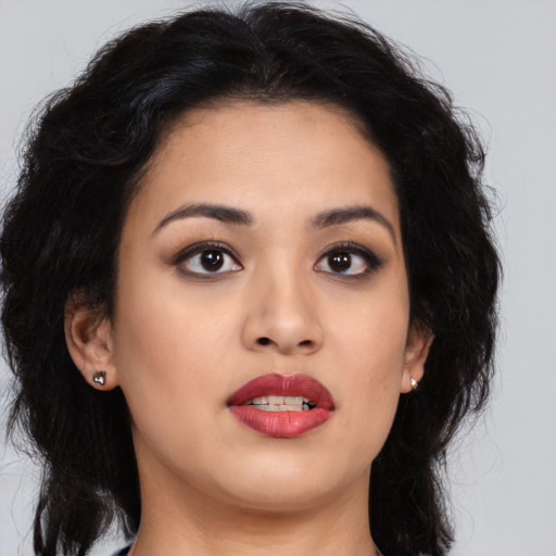 Joyful asian young-adult female with long  brown hair and brown eyes