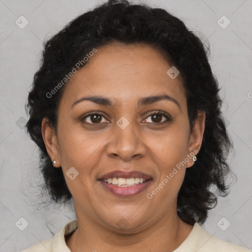 Joyful latino adult female with medium  brown hair and brown eyes