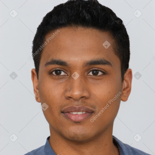 Joyful black young-adult male with short  black hair and brown eyes