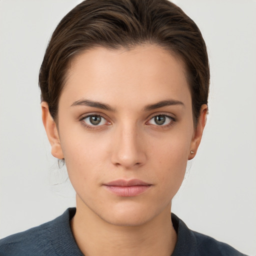 Neutral white young-adult female with short  brown hair and brown eyes