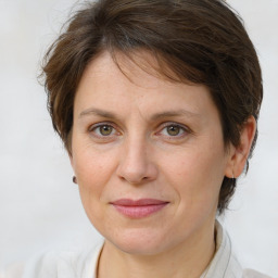 Joyful white adult female with medium  brown hair and brown eyes