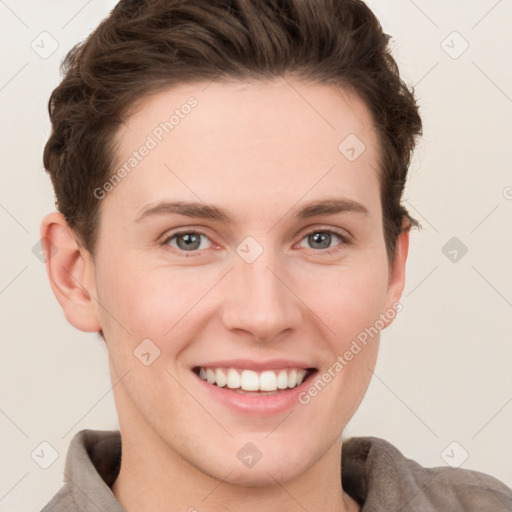 Joyful white young-adult female with short  brown hair and grey eyes