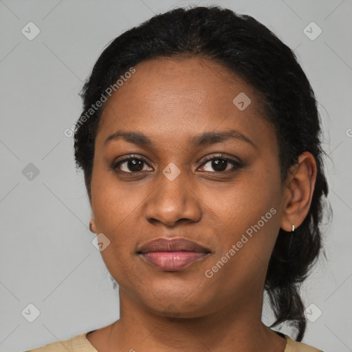 Joyful black adult female with medium  black hair and brown eyes