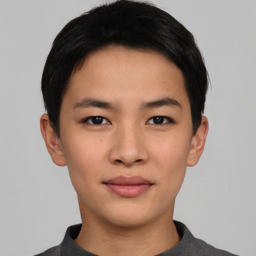 Joyful asian young-adult male with short  black hair and brown eyes