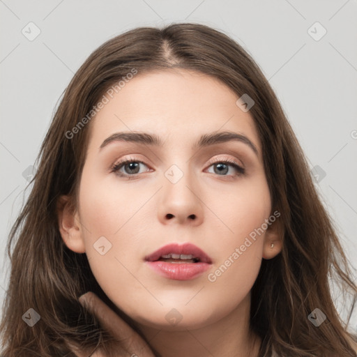 Neutral white young-adult female with long  brown hair and brown eyes