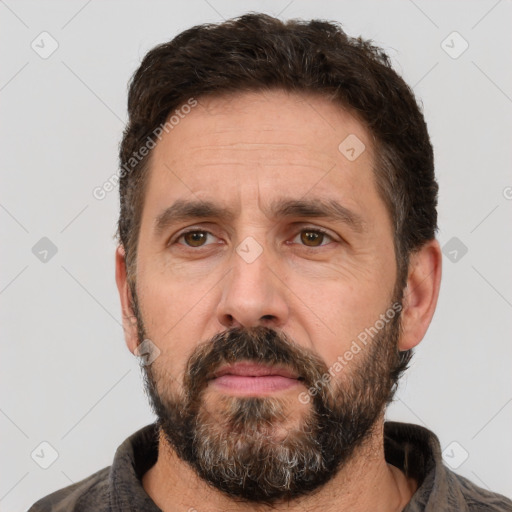 Neutral white adult male with short  brown hair and brown eyes