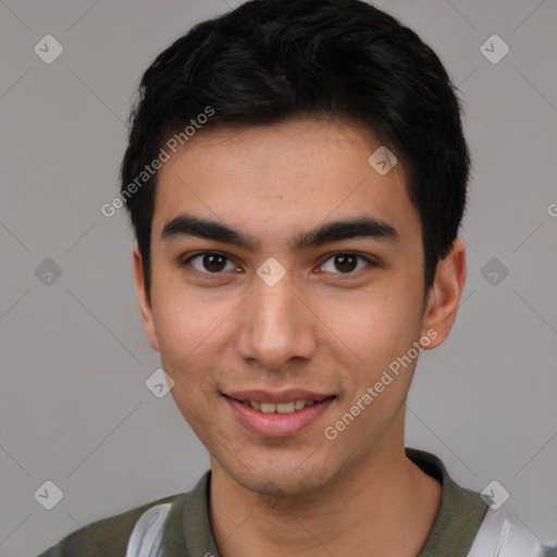 Joyful white young-adult male with short  black hair and brown eyes