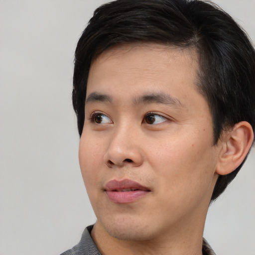 Neutral asian young-adult male with short  black hair and brown eyes