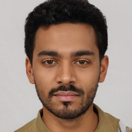 Neutral latino young-adult male with short  black hair and brown eyes