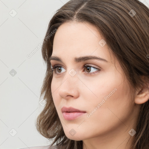 Neutral white young-adult female with medium  brown hair and brown eyes