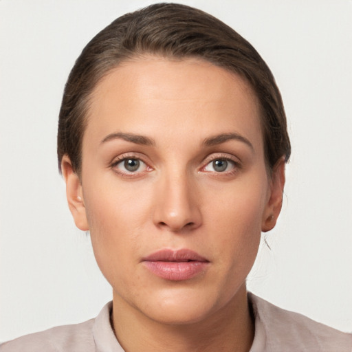 Neutral white young-adult female with short  brown hair and brown eyes