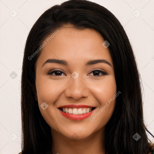 Joyful latino young-adult female with long  black hair and brown eyes