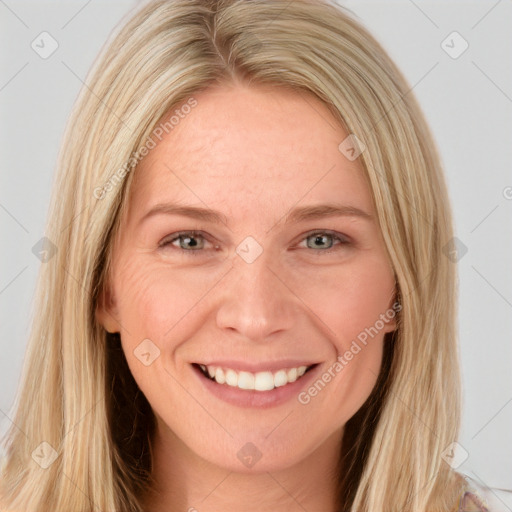 Joyful white young-adult female with long  brown hair and blue eyes