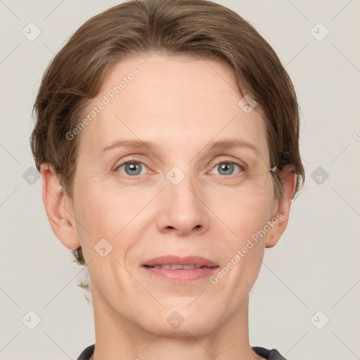 Joyful white adult female with short  brown hair and grey eyes