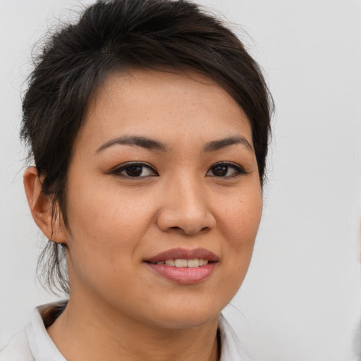 Joyful asian young-adult female with medium  brown hair and brown eyes