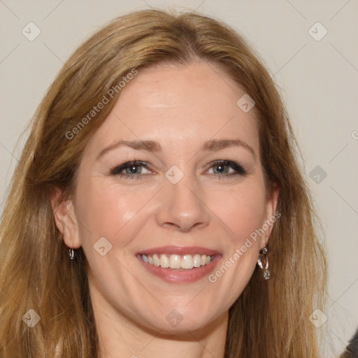 Joyful white adult female with long  brown hair and brown eyes