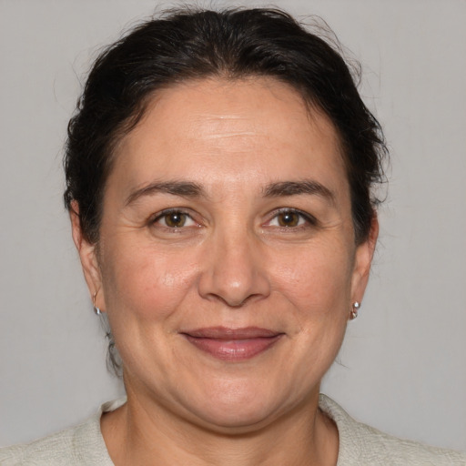 Joyful white adult female with short  brown hair and brown eyes