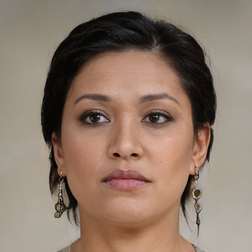Neutral latino young-adult female with medium  brown hair and brown eyes