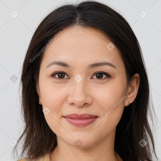 Joyful white young-adult female with long  brown hair and brown eyes