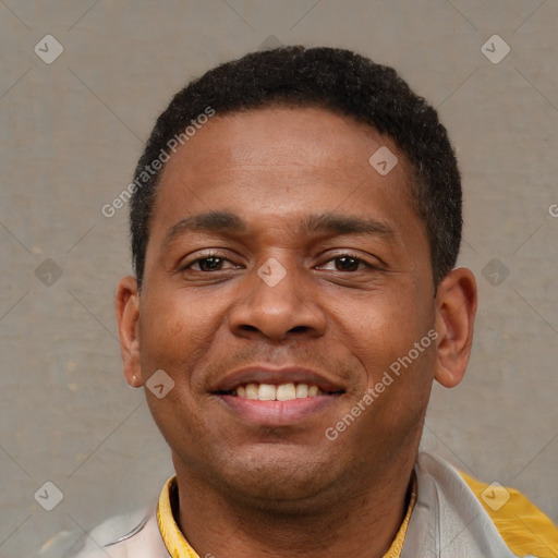 Joyful latino young-adult male with short  brown hair and brown eyes