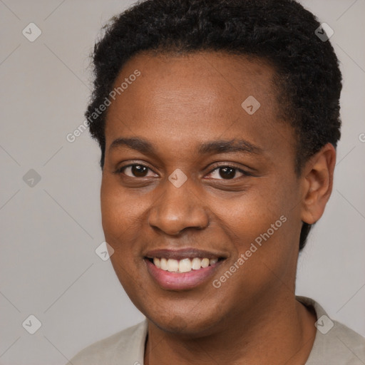 Joyful black young-adult male with short  brown hair and brown eyes