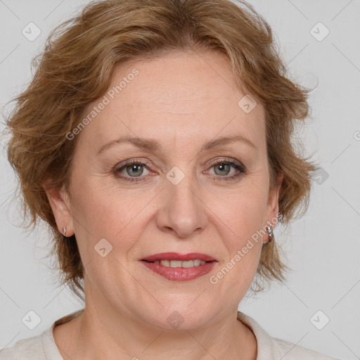 Joyful white adult female with medium  brown hair and blue eyes