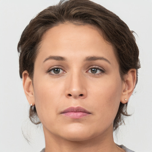 Neutral white young-adult female with medium  brown hair and brown eyes