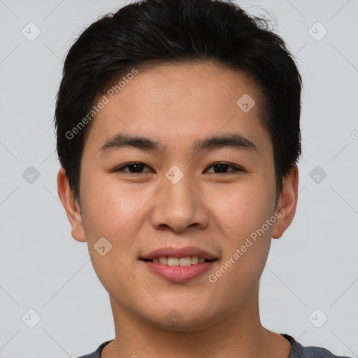 Joyful asian young-adult male with short  brown hair and brown eyes