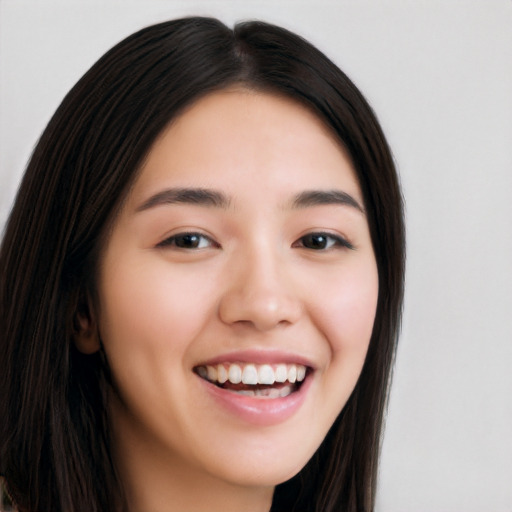 Joyful white young-adult female with long  black hair and brown eyes