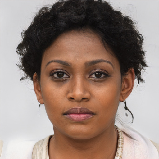 Neutral black young-adult female with short  brown hair and brown eyes