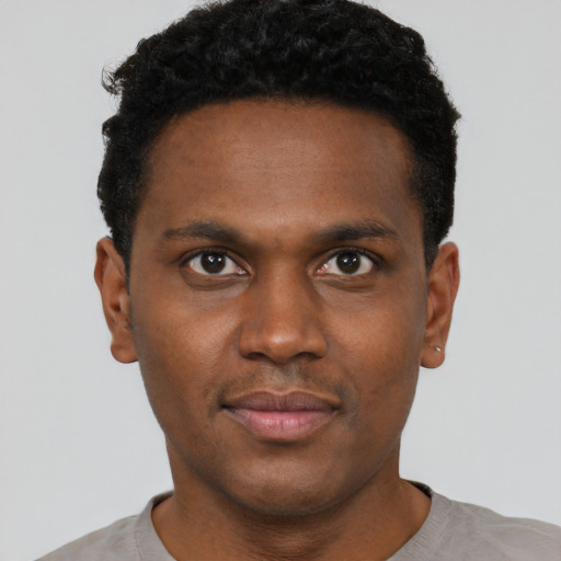 Neutral black young-adult male with short  brown hair and brown eyes