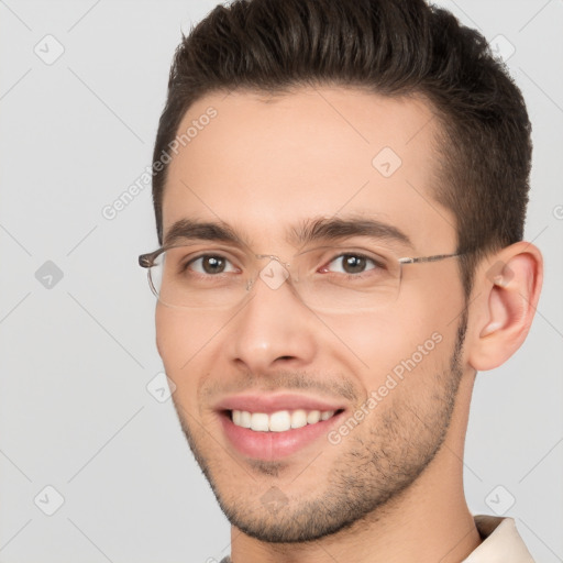 Joyful white young-adult male with short  brown hair and brown eyes