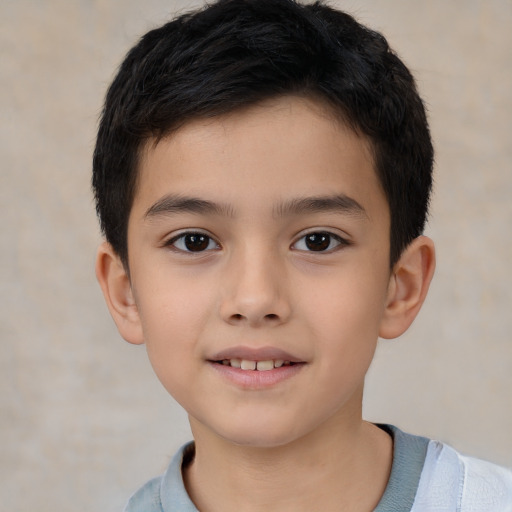 Joyful white child male with short  brown hair and brown eyes