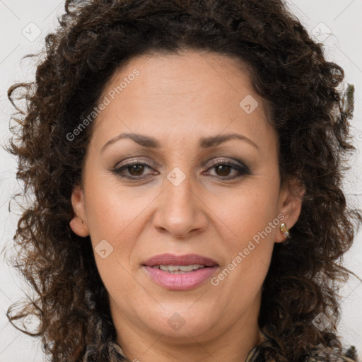 Joyful white adult female with long  brown hair and brown eyes