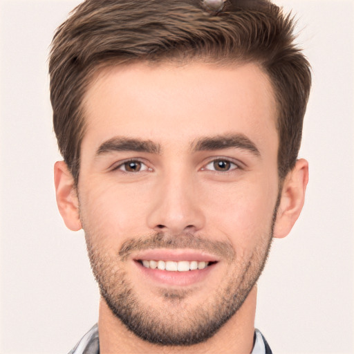 Joyful white young-adult male with short  brown hair and brown eyes