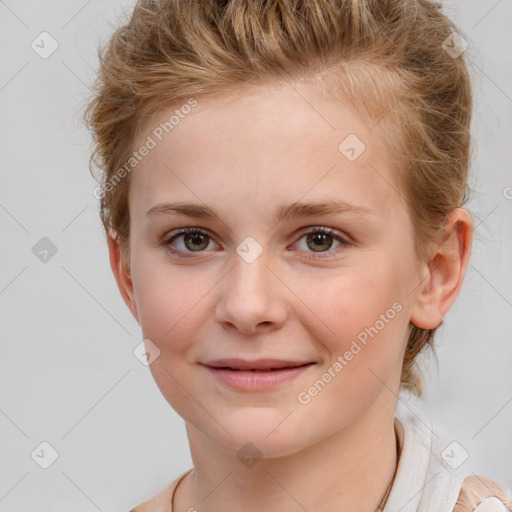 Joyful white child female with short  brown hair and brown eyes