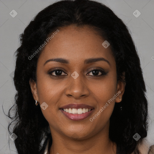 Joyful black young-adult female with long  brown hair and brown eyes