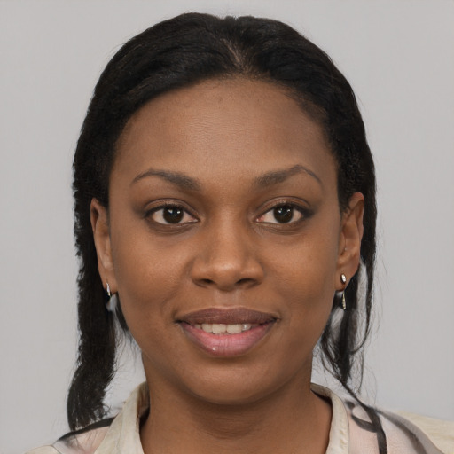Joyful black young-adult female with medium  brown hair and brown eyes