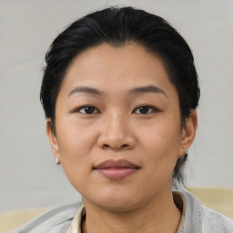 Joyful asian young-adult female with short  brown hair and brown eyes