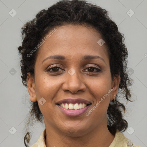 Joyful black young-adult female with medium  brown hair and brown eyes