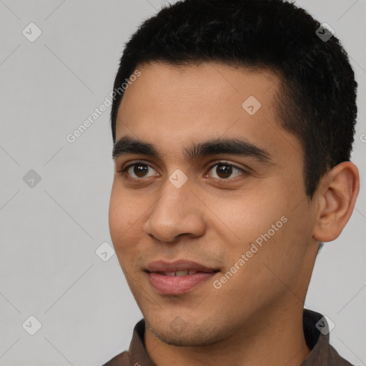 Joyful latino young-adult male with short  black hair and brown eyes