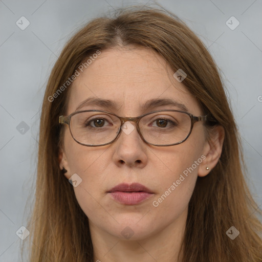 Joyful white adult female with long  brown hair and brown eyes