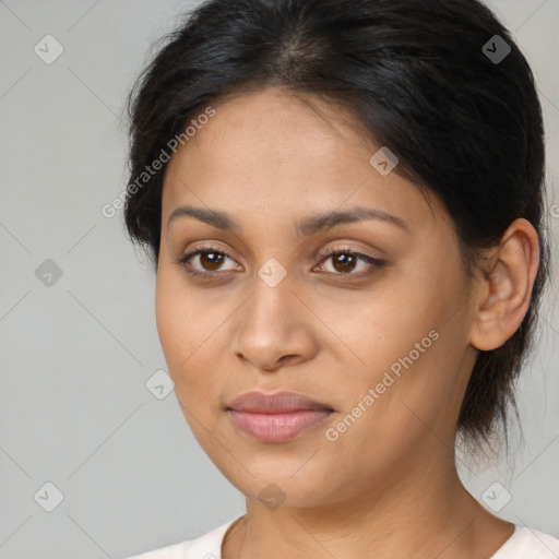 Joyful latino young-adult female with medium  brown hair and brown eyes