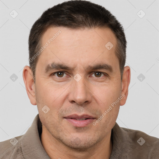 Joyful white adult male with short  brown hair and brown eyes