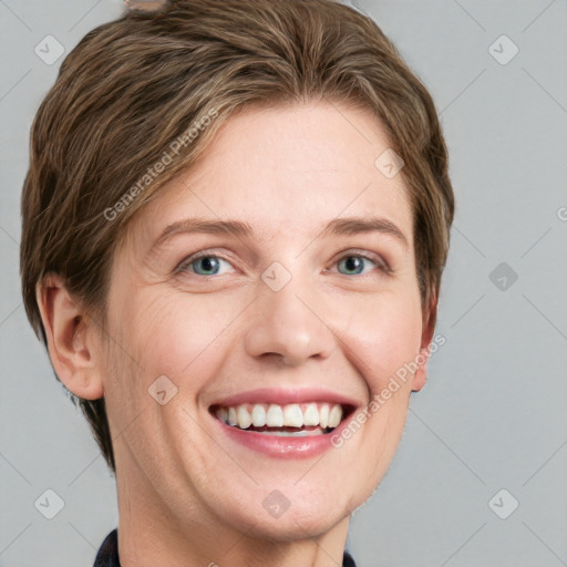 Joyful white young-adult female with short  brown hair and grey eyes