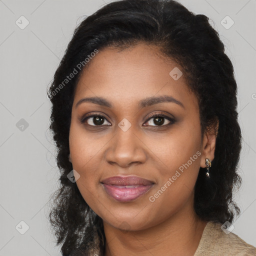 Joyful black young-adult female with long  black hair and brown eyes