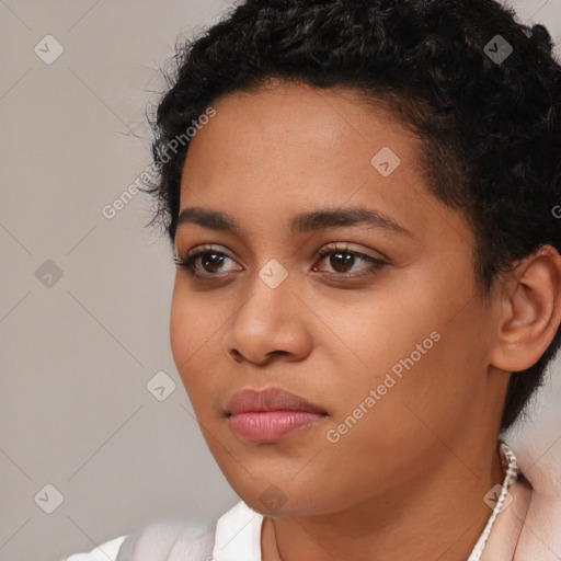 Joyful latino young-adult female with short  black hair and brown eyes