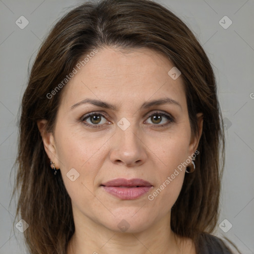 Joyful white adult female with long  brown hair and brown eyes