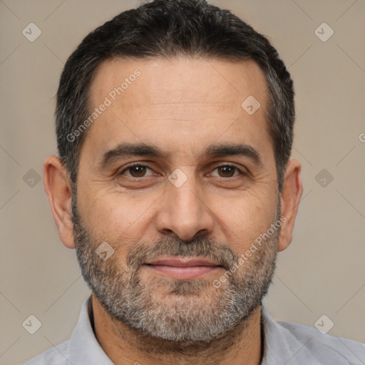 Joyful white adult male with short  black hair and brown eyes