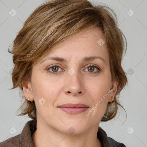 Joyful white adult female with medium  brown hair and grey eyes